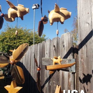 Flying pig  surfboard ,changeable feather spinner. UV/ Weatherproof. Strong nylon fishing net .