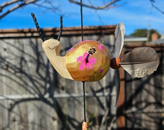 Snails handmade painted with acrylic gold ,weatherproof feather spinner for indoor or outdoor decor. Coco nut pot 3.8&quot;