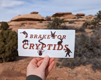 I Brake For Cryptids Large Sticker, Loch Ness, Mothman, Sasquatch, Jackalope, Kraken, Chupacabra | Bumper, Laptop Sticker 7.5" x 3.75"