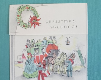 May include: Vintage Christmas card with a winter scene. The card features a horse-drawn carriage, people in period clothing, and the words "CHRISTMAS GREETINGS." A holly wreath with a poinsettia is at the top.