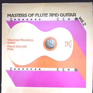 May include: Album cover for "Masters of Flute and Guitar, Vol. 2." The design features a white guitar shape with an orange sound hole, a flute, and a purple and orange background. The text includes the names of the musicians and the album title.