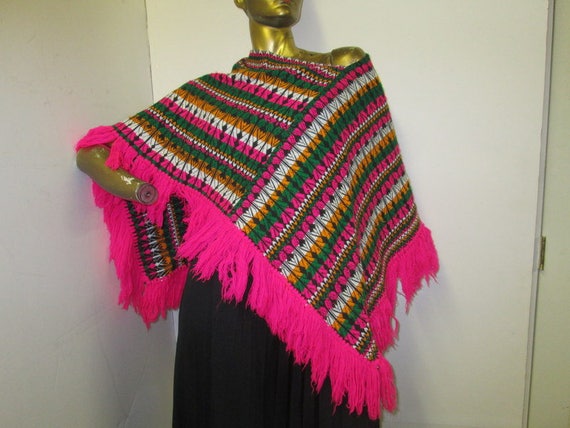 vintage 70s Guatemalan fringed poncho in a vibrant