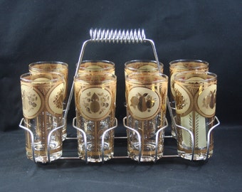 Cera (labeled) 22K Gold "Pineapple with Fruit" Set of 8 Highball Glasses with Chrome Plated Carrier (1980s).