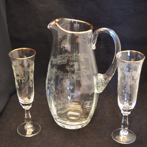 Pitcher with two Matching Wine Flutes, Gold Rims, Etched Drape and Floral Ribbed Crystal