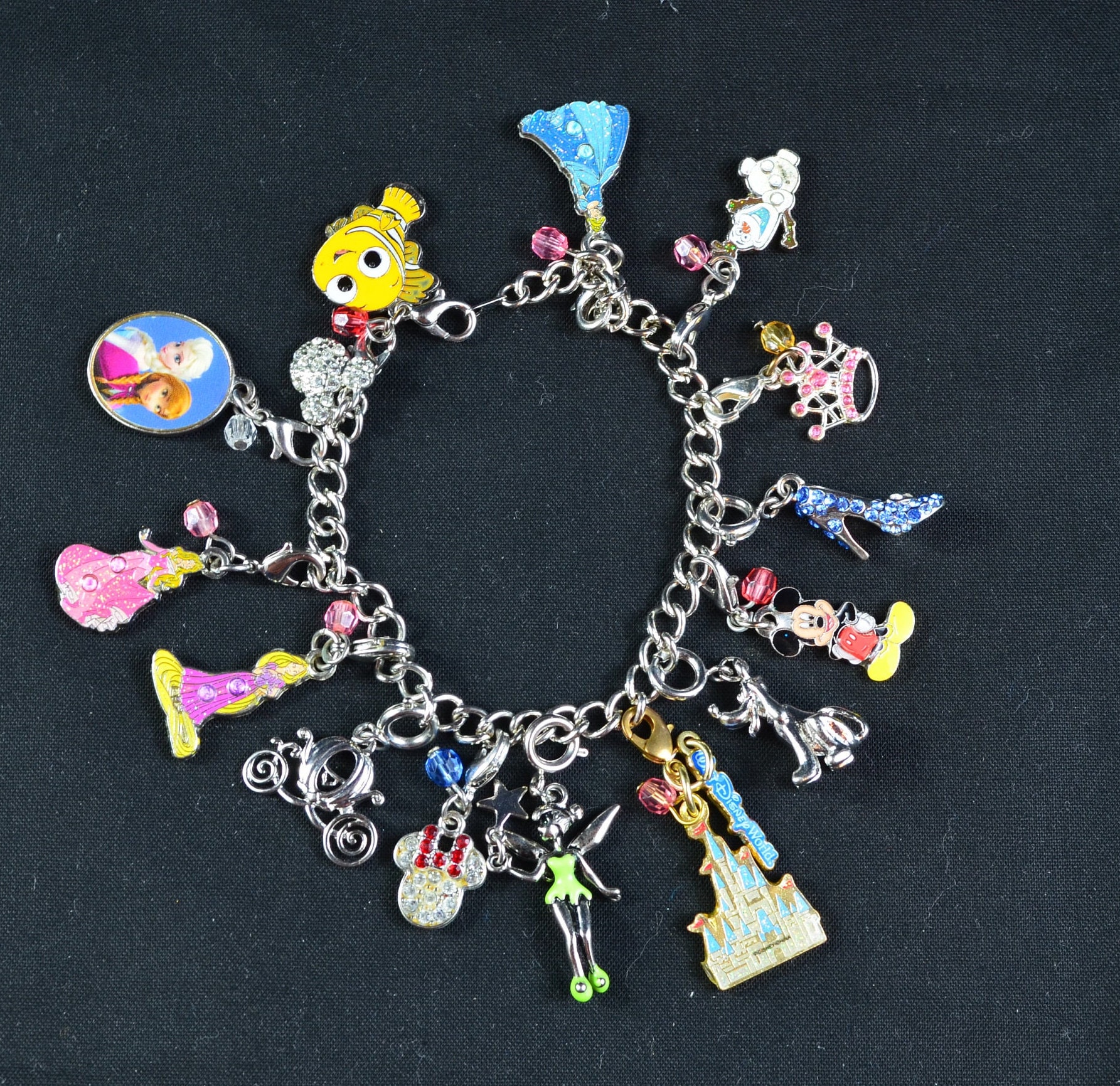 Sold at Auction: Pandora sterling charm bracelet from Disney park