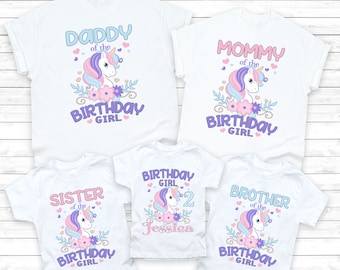 May include: Set of five white t-shirts featuring a unicorn and floral design. The shirts read "Daddy of the Birthday Girl", "Mommy of the Birthday Girl", "Sister of the Birthday Girl", "Birthday Girl 2 Jessica", and "Brother of the Birthday Girl".