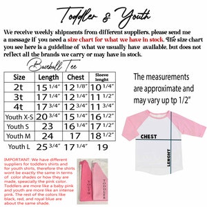 May include: Size chart for toddler and youth baseball tees. The chart shows sizes from 2T to Youth L with measurements for length, chest, and sleeve length in inches. The chart also includes a note about the measurements being approximate and may vary up to 1/2 inch.