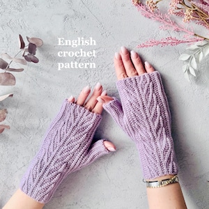 May include: A pair of lavender fingerless gloves with a leaf stitch pattern. The gloves are crocheted and are shown on a person's hands. The text "English crochet pattern" is written in white on a gray background.