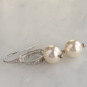 Cream pearl drop earrings with silver ear wires