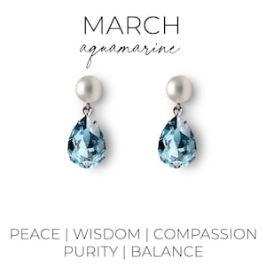 Aquamarine crystal earrings with a pearl post on an earring card that says "March, aquamarine" at the top and "Peace, Wisdom, Compassion, Purity, and Balance" at the bottom