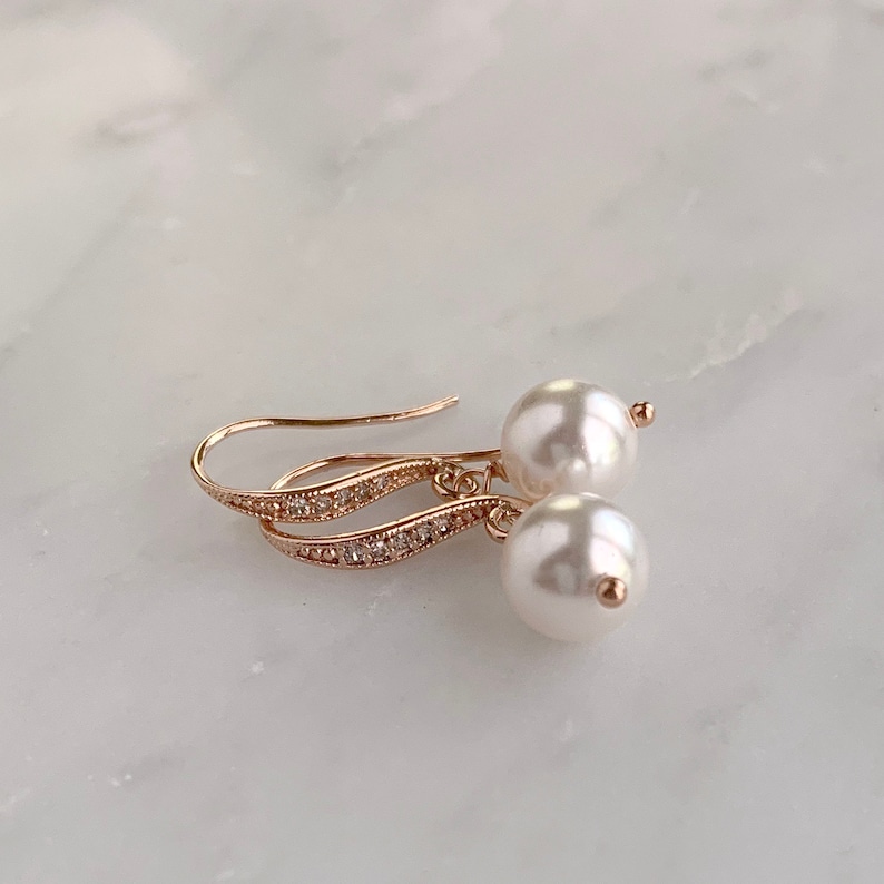 A simple pearl earring with crystal embellished ear wires