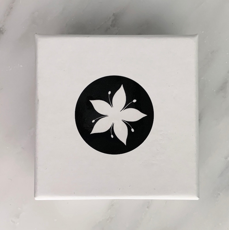 The Tigerlilly logo box features a black and white logo of a lily flower