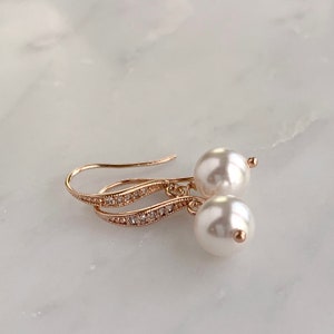 White pearl drop earrings with rose gold ear wires