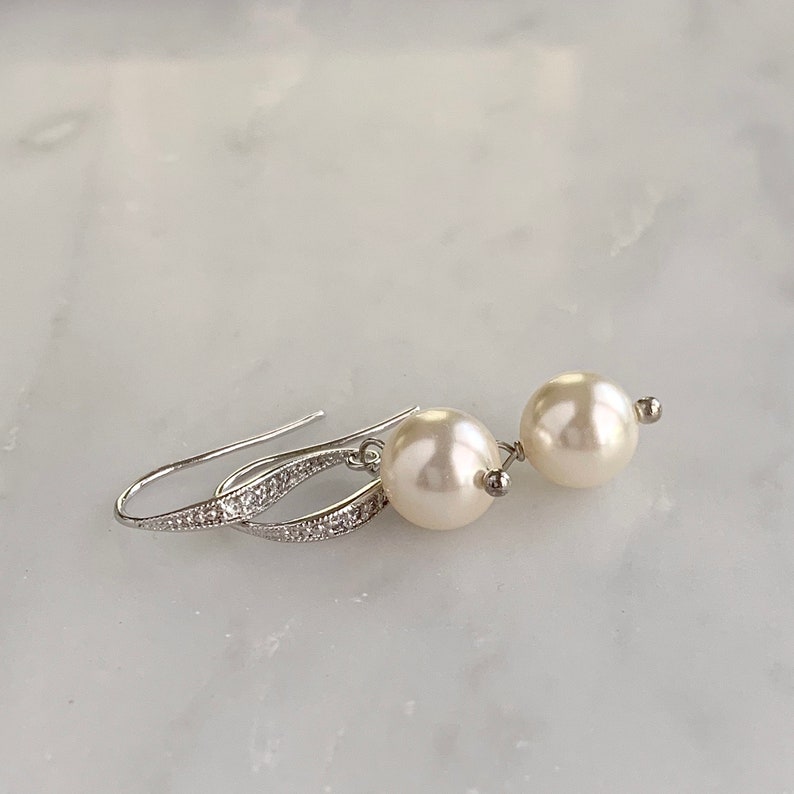 Cream pearl drop earrings with silver ear wires