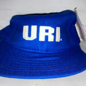 May include: A blue baseball cap with a white felt URI logo.