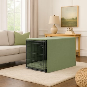May include: A rectangular black wire pet crate covered with a solid sage green fabric cover that drapes over the top and sides. The crate features a matching sage green padded mat inside the base, providing a soft surface for a pet to rest comfortably.