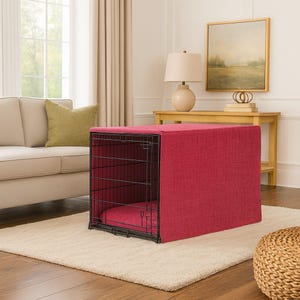 May include: A rectangular black wire pet crate covered with a textured, solid dark pink fabric cover. The crate features a matching dark pink padded mat inside the base, providing a soft surface for the interior floor of the metal enclosure.