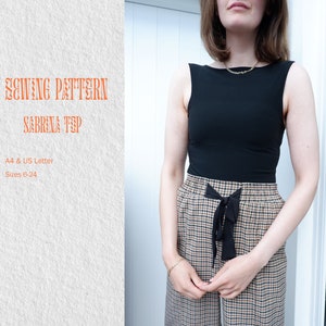May include: A sewing pattern for a Sabrina top, available in sizes 6-24. The pattern is printed on A4 and US Letter paper.