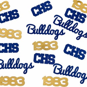 May include: A collection of die-cut paper confetti pieces featuring the text 1983 in gold, and CHS and Bulldogs in dark blue. The pieces are scattered in various orientations, showcasing the school-themed lettering and numbers.