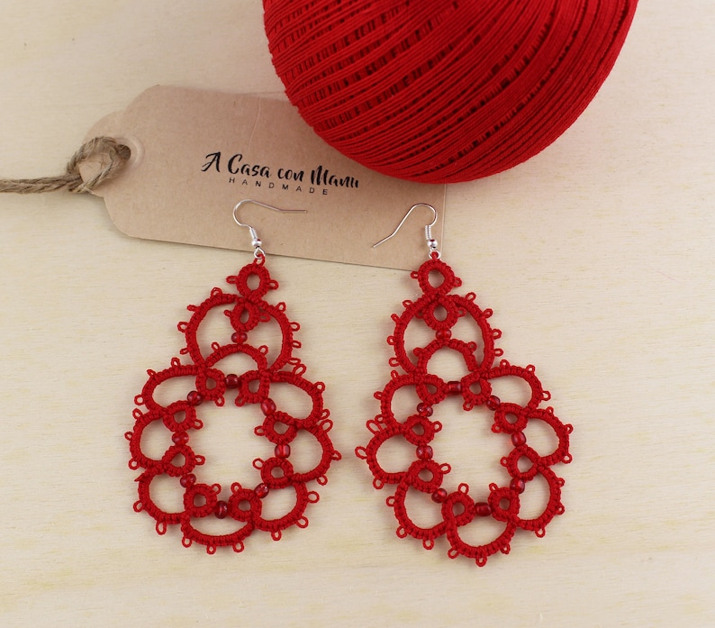 Red earrings in cotton and beads