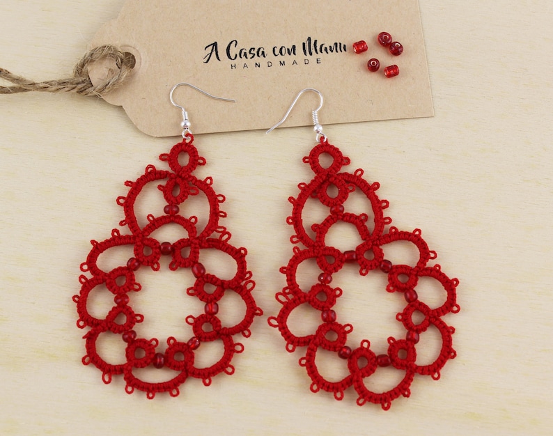 Red earrings in cotton and beads