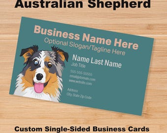 May include: A rectangular business card with a teal background featuring a colourful illustration of an Australian Shepherd dog. The card includes placeholder text for a business name, slogan, contact information, and a name with job title.