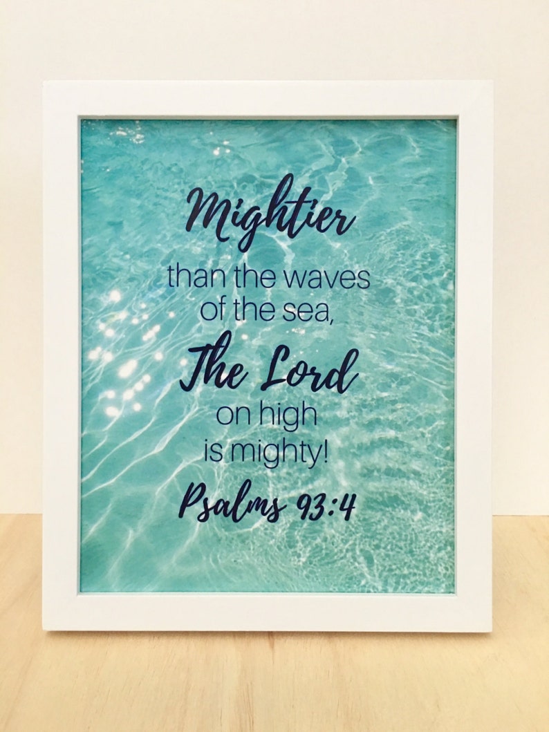 May include: White framed print with a turquoise blue water background. The text reads "Mightier than the waves of the sea, The Lord on high is mighty! Psalms 93:4"