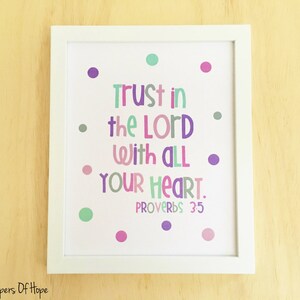 May include: A white framed print with a white background and colorful polka dots. The print features the text "Trust in the Lord with all your heart. Proverbs 35".