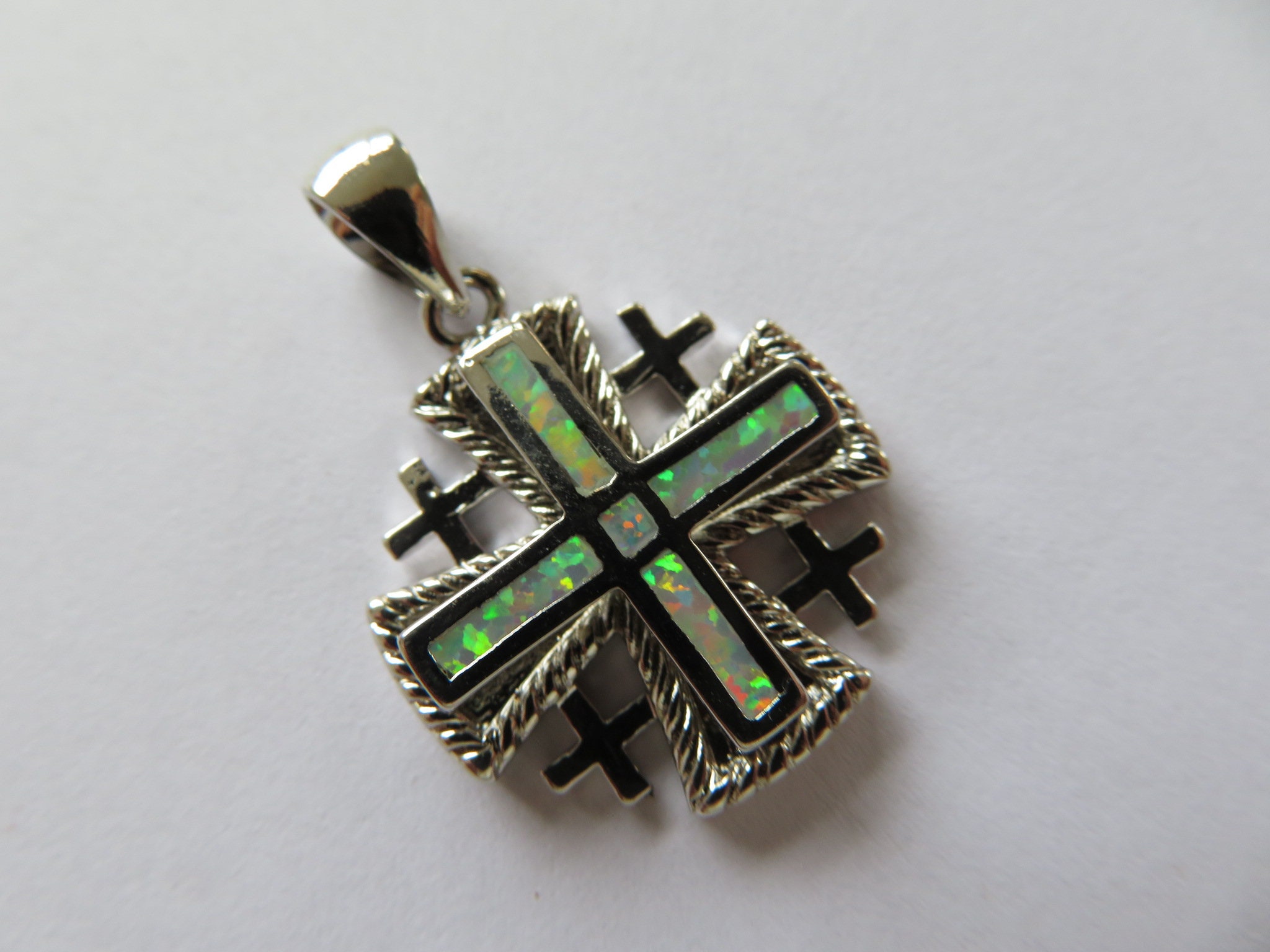 18-Inch Rhodium Plated Necklace with 6mm Light Rose Birthstone Beads and Sterling Silver Jerusalem Cross Charm. 18-Inch Rhodium Plated Necklace with 6mm Light Rose Birthstone Beads and Sterling Silver Jerusalem Cross Charm.