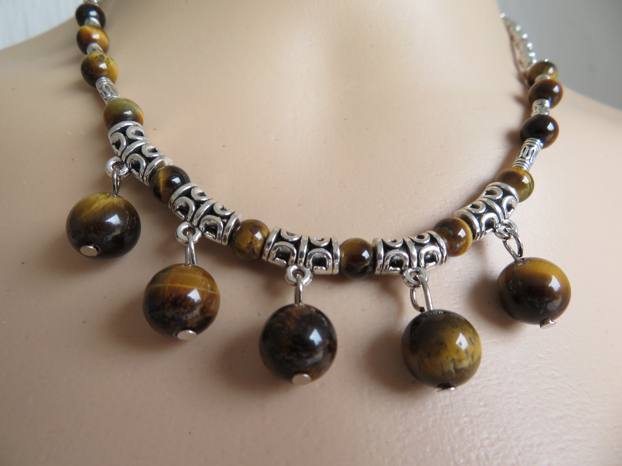 Brown Cats Eyes necklace- Brown beads mounted between Tibetan Silver ...