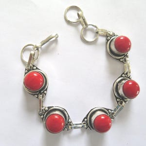 Bracelet-synthetic Coral-5 round Coral red crystals in silver floral mounts- silver adjustable chain and  linked bracelet-