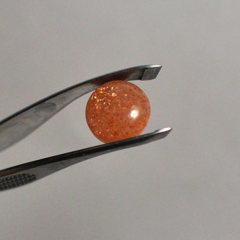12x4.5 mm Natural Sunstone Cabochon Gemstone Orange color Round shape Ring size 4.55 Cts.