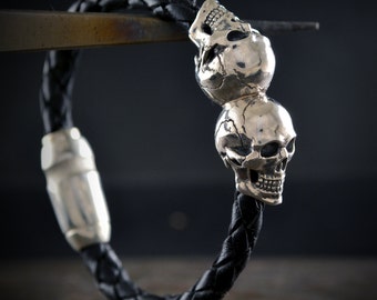 Skulls bracelet, Leather bracelet with two  skulls in solid sterling silver and natural stones in the eyes