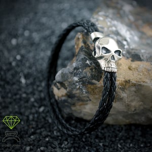 Sterling silver skull bracelet with black leather