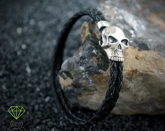 Sterling silver skull bracelet with black leather