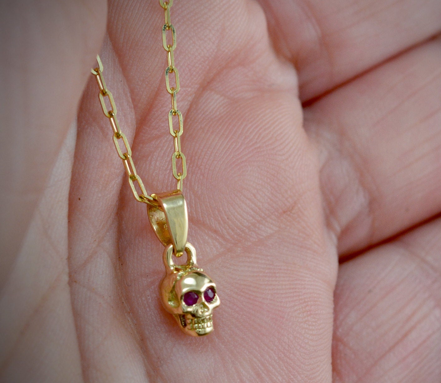 14K Gold tiny skull charm with natural 