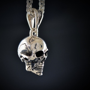 Silver human skull pendant with oxidized textures, Memento mori pendant