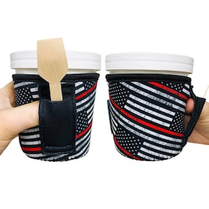 May include: Two black and white insulated cup holders with a red, white, and blue American flag design. One holder has a slot for a spoon or straw.