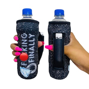 May include: Two black water bottle holders with a sparkly finish. One holder has the text "F*CKING FINALLY" and a diamond ring graphic. The other holder has a pocket for a lip balm or other small item.