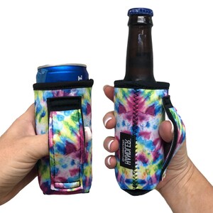May include: Two tie-dye can and bottle coolers with a black handle. The coolers are made of neoprene and have a white background with pink, blue, and yellow tie-dye patterns. The text "HANDLE" is printed on the bottle cooler.
