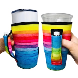 May include: A rainbow-striped neoprene cup holder with a built-in pocket for a lip balm or other small item. The holder is designed to fit a standard-sized cup and has a comfortable handle.