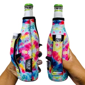 May include: A tie-dye patterned neoprene bottle holder with a built-in pocket for a lip balm or other small item. The holder has a black handle and the text "HANDLER" and "BUILT HANDLERS" is printed on the side.