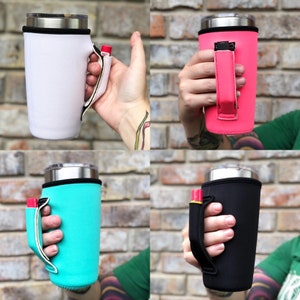 May include: Four different color insulated cup holders with a handle. The holders are white, pink, teal, and black. The holders are made of neoprene and have a zippered closure.