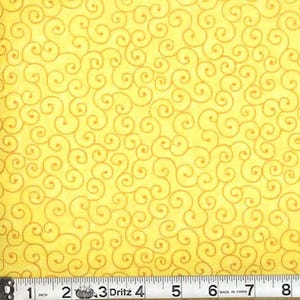 May include: Yellow fabric with a repeating pattern of swirling, golden-brown lines. The fabric is measured with a ruler showing inches.