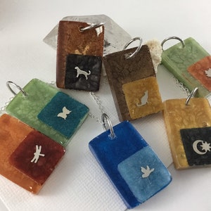 One of a kind tiny sterling figure resin pendants sold separately