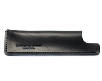 May include: Black leather case with a stitched edge and the text "Chicago Comb Co. in England Made in USA" embossed on the front.