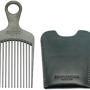 May include: A black carbon fiber comb with a handle and a black leather carrying case. The comb is labeled "Chicago Comb Co." and "Model No. 7 Carbon Fiber Made in USA". The case is labeled "Chicago Comb Co. Made in USA".