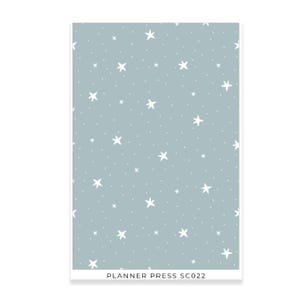 May include: A rectangular sheet with a light blue background covered in white stars and small white dots. The text "PLANNER PRESS SC022" is printed at the bottom in white.