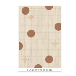 May include: A beige background with a grid pattern, adorned with brown circles and gold star shapes. The text "PLANNER PRESS SC023" is at the bottom. The design has a textured, crumpled paper effect.