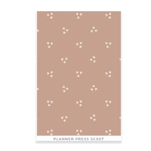 May include: A rectangular card with a repeating pattern of small white star-like shapes on a muted brown background. The text "PLANNER PRESS SC007" is printed at the bottom. The design is simple and minimalist.